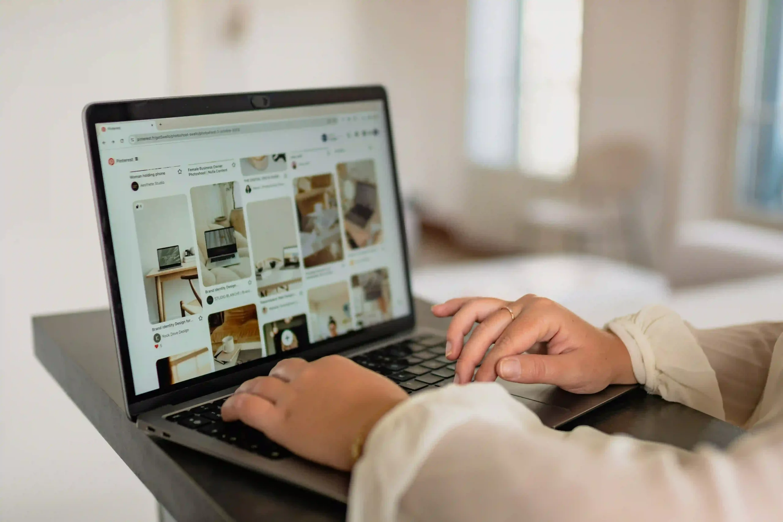 a lady is working on a laptop